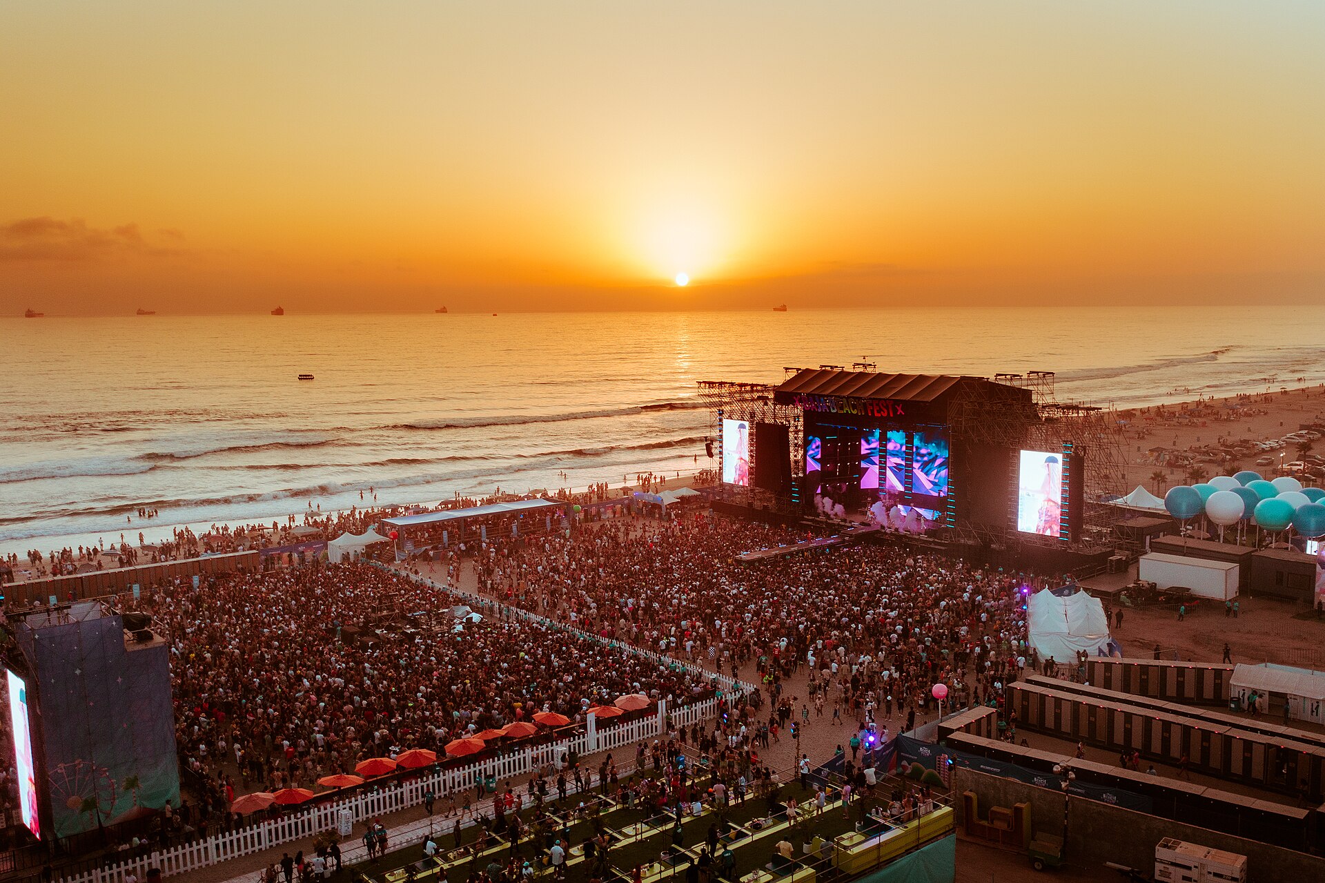 Crowd at a beach festival in Rosarito at sunset